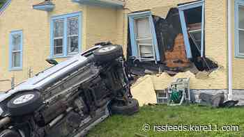 Teens in custody after vehicle taken in armed carjacking hits Minneapolis home