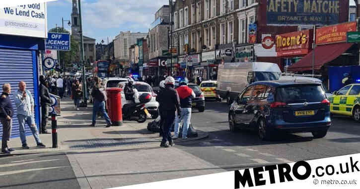 Two teenage girls stabbed in London with four boys arrested