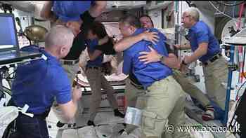 Hugs of welcome for new arrivals on space station