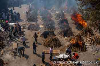 India's crematoria overwhelmed as virus 'swallows people like a monster' - St Helens Star