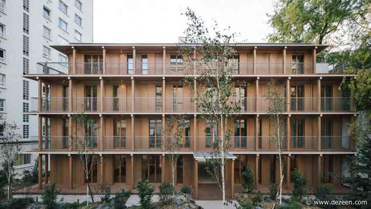 Mars Architectes creates wooden apartment block enclosed by 1970s housing