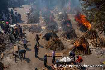India's crematoria overwhelmed as virus 'swallows people like a monster' - Barrhead News