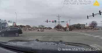 St. Cloud driver runs red light, gets pushed into squad car by semi