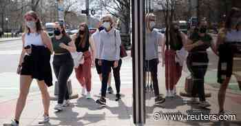 Citing 'stunning progress' on coronavirus, Biden lifts outdoor mask guidelines - Reuters
