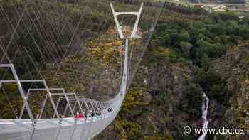 Portuguese town tempts tourists, touts opening of massive pedestrian bridge