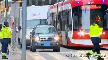 Driver charged after allegedly hitting Toronto traffic agent multiple times with his vehicle