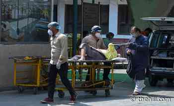 US to ban most travel from India amid COVID-19 spike
