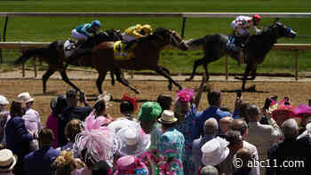 With fans and flowery hats, Kentucky Derby is back at old home in May