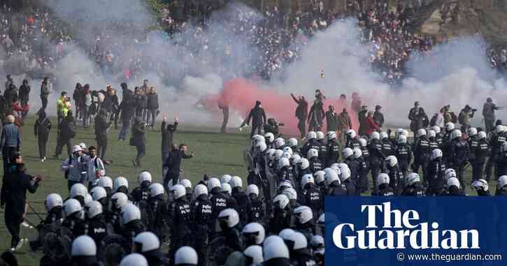 Riot police break up illegal party in Brussels park using tear gas and water cannon – video