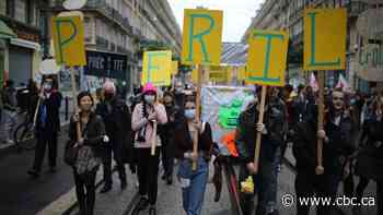 May Day protesters march for better job protections amid pandemic