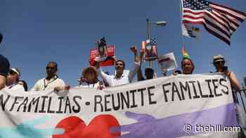 First migrant families reunited in 'beginning' of larger effort