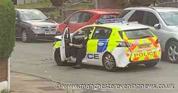 Audi rams into police car 'multiple times' after man stabbed in Bolton robbery - Manchester Evening News