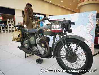 Veterans group host stand featuring military vehicles in the Mall