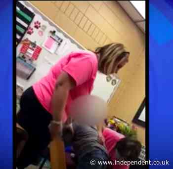 Police clear teacher caught on camera spanking a child with a paddle