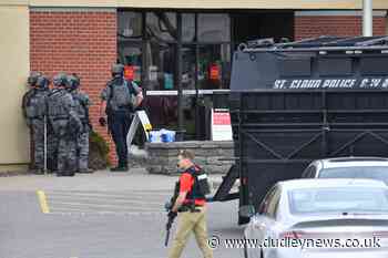Four hostages released as stand-off continues at Minnesota bank - Dudley News