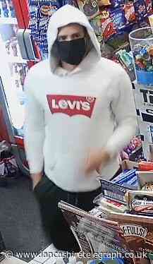 Masked man threatened Accrington shopkeeper before escaping with stash of cash and cigs