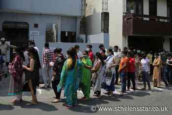 India declares more lockdowns as Covid surge hits southern states - St Helens Star
