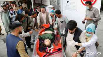 Bomb blasts kill dozens near school in Afghan capital