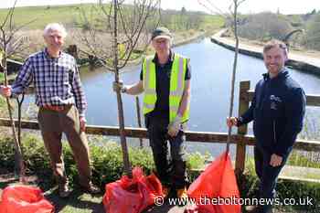 A waterside orchard has been planted to combat flood risk in Prestolee and Nob End Locks.