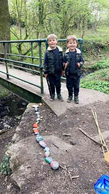Two Bolton boys rescue stone snake thrown into stream