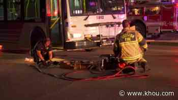 HFD: Man trapped under METRO bus rescued in downtown Houston - KHOU.com