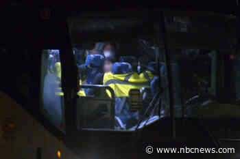 Some migrant children stuck overnight on parked buses before going to family or sponsors, advocate says