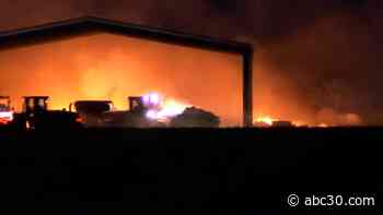 Giant haystack catches fire in Madera County