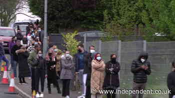 Bolton residents queue outside mobile vaccine centre - The Independent