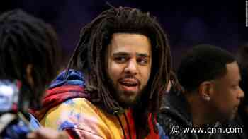 Rapper J. Cole makes his debut in African basketball league the same weekend his album drops