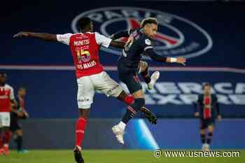 Soccer-PSG Cling on to Title Hopes as Leaders Lille Held