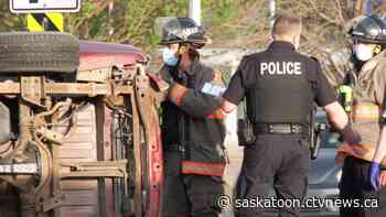 While heading back to station from another call, firefighters help driver after rollover