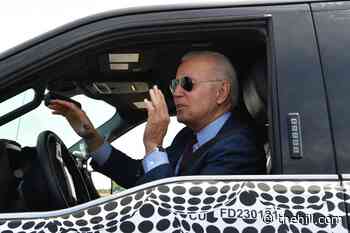 Biden test drives electric truck during stop in Michigan