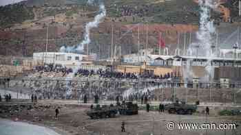 Thousands of migrants swim from Morocco to Spanish enclave