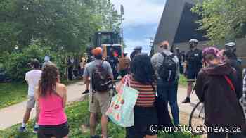 Tensions flare as Toronto homeless encampment cleared by city officials