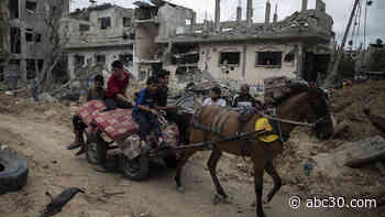 Palestinians see victory in Gaza truce as Israel vows 'new level of force' to further attacks