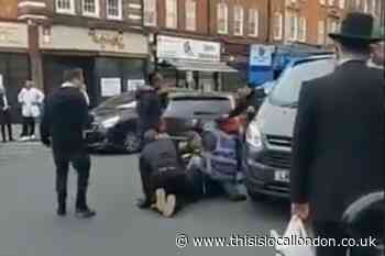 Man arrested after ' driver of car with Israeli flag attacked'