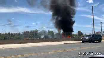 Firefighters battling grass fire in downtown Fresno