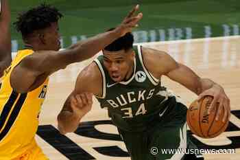Khris Middleton Lifts Bucks Past Heat in OT in Game 1