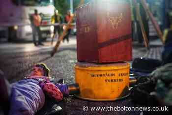 14 arrests after activists blockade McDonald’s depots