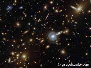 NASA's Hubble Telescope Captures Image Of Galaxy Cluster 3.5 Billion Light-Years Away