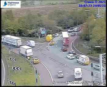M62: Ambulance at the scene after collision near Simister Island
