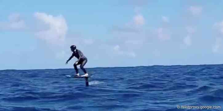 Photos reveal Mark Zuckerberg surfing while wearing an $84 bracelet that claims to fend off sharks