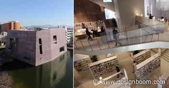 monolithic library extension by maru architecture floats on serene pond in matsubara, japan - Designboom