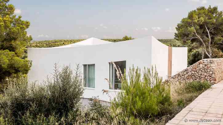 Nomo Studio carves curved patios and terraces into Menorcan holiday home