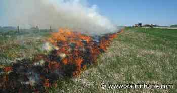 When should motorists report a roadside fire?