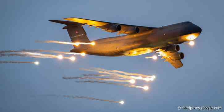 Amazing photos show the Air Force's biggest plane testing flares to lure away enemy missiles