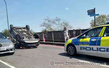 Catford Bridge: Two in hospital after car flips during crash