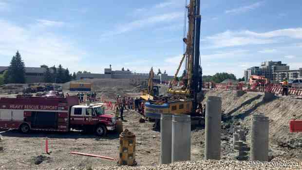 Construction worker partially buried at Bridgeland worksite
