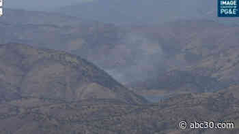 Wildland fire threatening structures near Pine Flat Lake