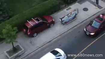 WATCH: Driver of stolen vehicle races down Toronto sidewalk - 680 News